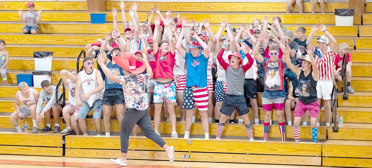 Rane Kenzy gets a wild student section fired up at the volleyball game.