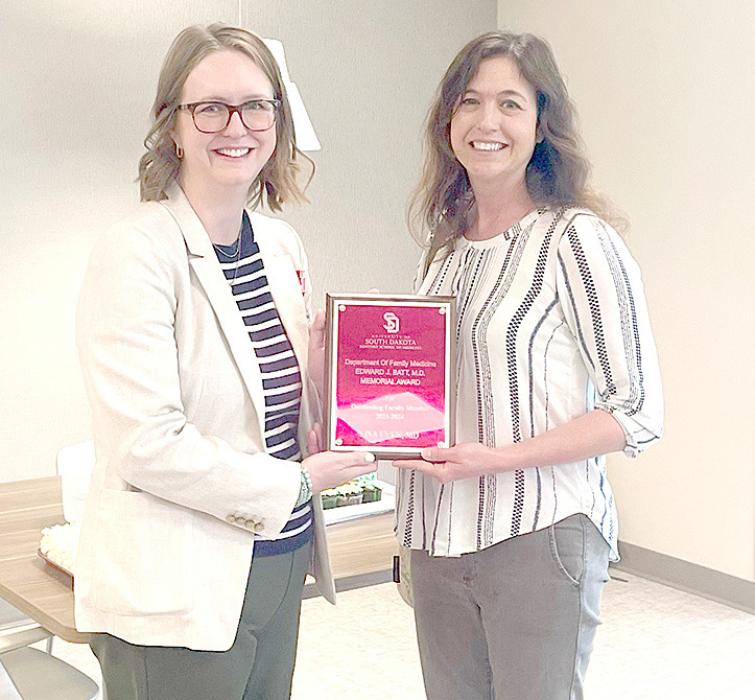 Dr Carolyn Gilbertson, Department Chair for USD Sanford School of Medicine, presents a plaque to Dr. Even on Thursday, May 23, 2024. The award was established to recognize an outstanding clinic faculty member from the Department of Family Medicine.