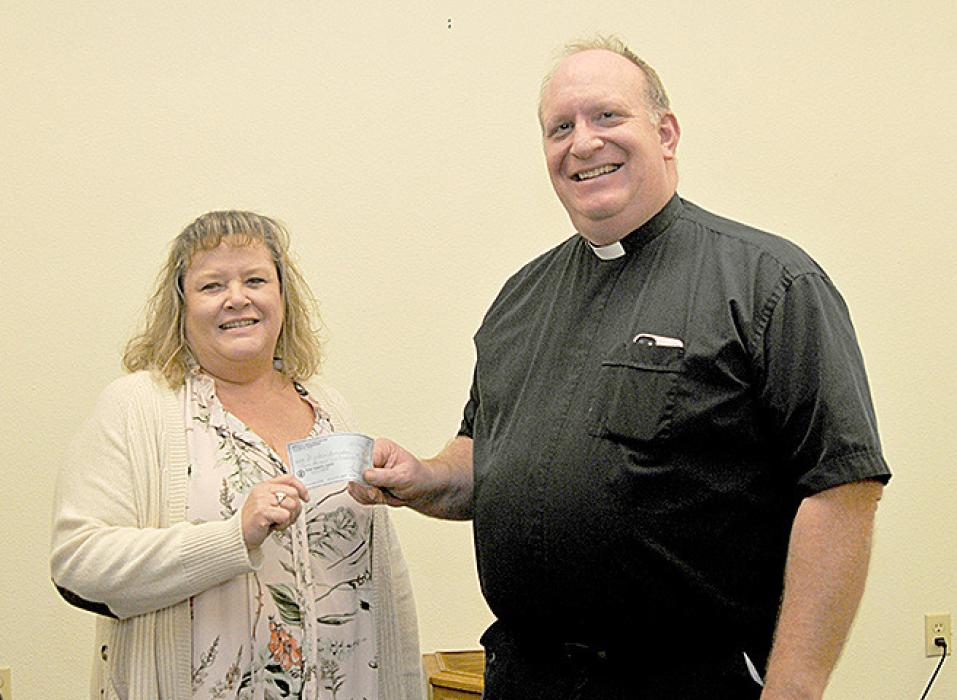 Gregory Area Healthcare System and Foundation donates proceeds from the fundraising event held on September 9, 2023. Sandi Karl Wernke, representing the Avera Foundation, presented a check to Marcus Ring, representing the Gregory Ministerial Association. The funds will be used for the voucher system for emergency needs such as housing, gas, food, or prescriptions.