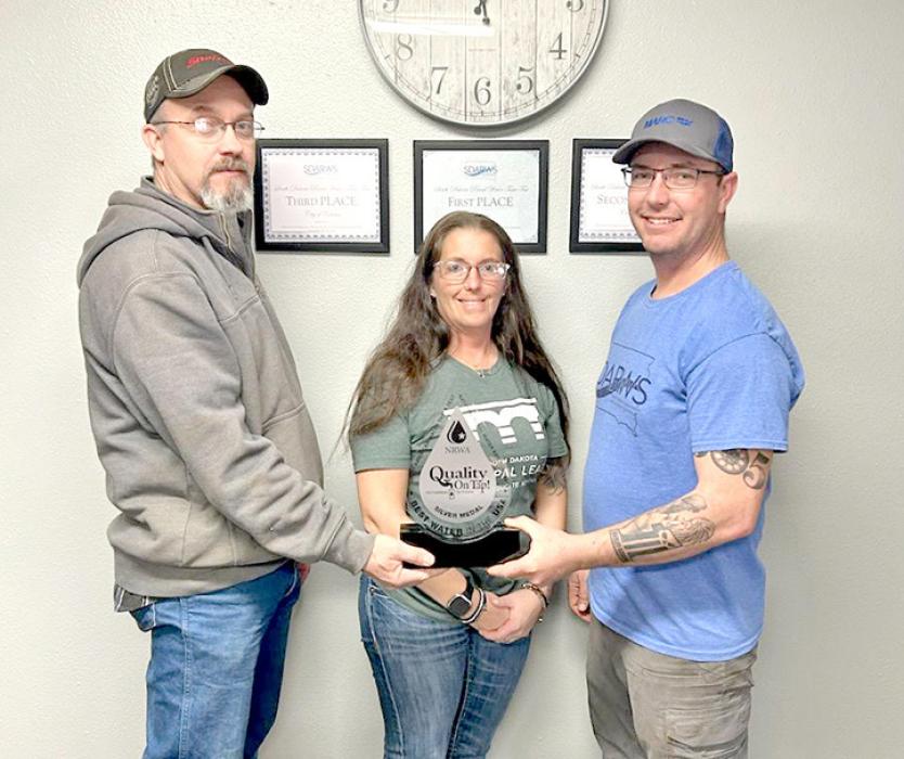 Colome Mayor Kelly Leighton, City Administrator Bobbi Harter, and Utility Manager Casey Harter are shown here with the trophy for 2nd place in the 27th annual Great American Water Taste Test. (submitted photo)