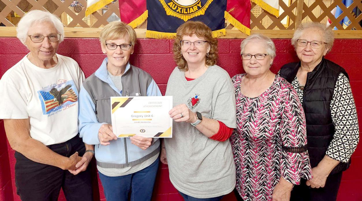 American Legion Auxiliary of Gregory was recognized for reaching 114% in membership, surpassing their goal. State President Patsy Madsen presented Cindy Diekmann, membership chairperson for Unit 6, a certificate for 91 members. Janice Grenoble, Cheryln Shaffer, and Sandi Jones were also present at the presentation.