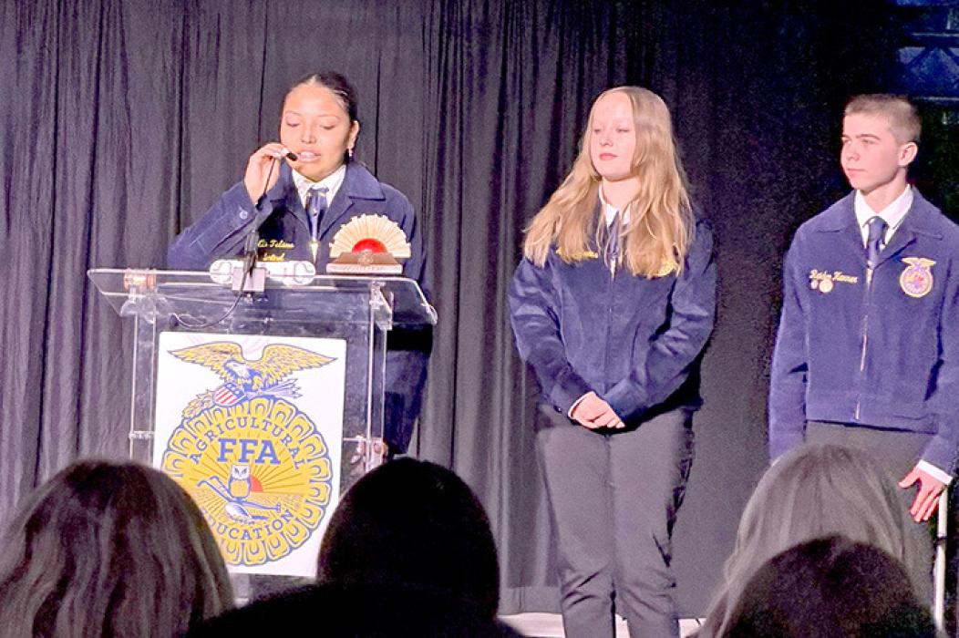 Ellie Talsma helped introduce State FFA State Treasurer Laney Andrews for her retiring address.