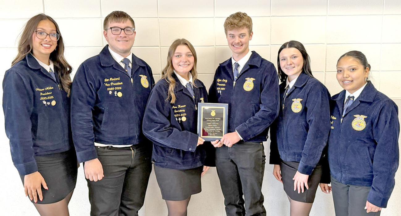The Gregory County FFA 25-26 officer team of President Aubree Miller, VP Leo Mosterd, Secretary Ava Kerner, Treasurer Tyler Kenzy, Reporter Daytona Paris, and Sentinel Ellie Talsma are shown l to r with their 7th place National Chapter plaque.