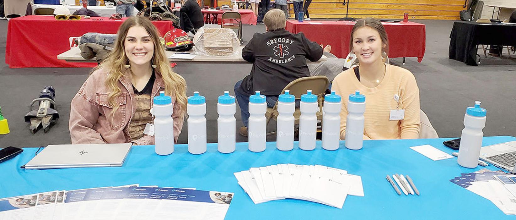 Lauren Svatos, l, and Brooklyn VanDerWerff, r, spoke to attendees about work-from-home opportunities with Principal Financial.