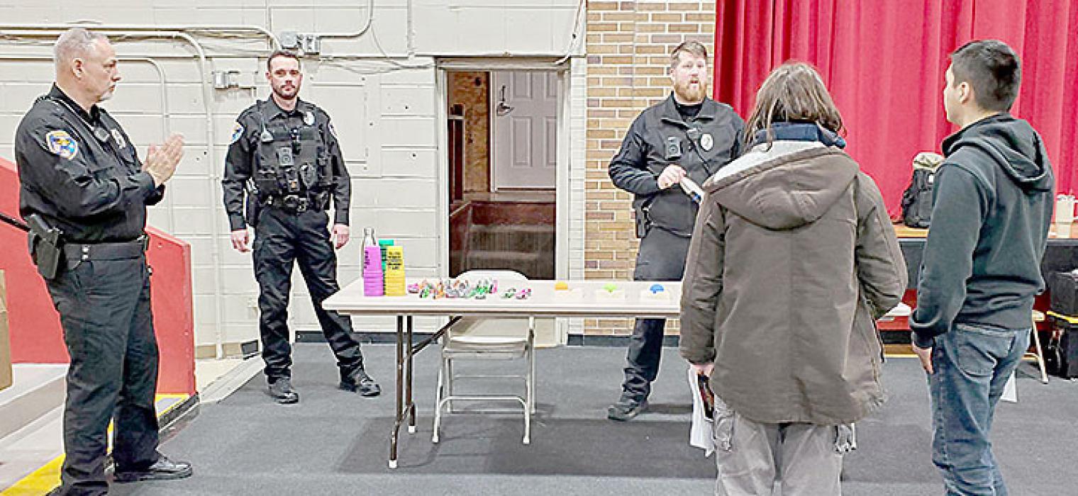 A career in the military or law enforcement is a popular choice among the high school students surveyed. Here, two students visit with Gregory’s police officers, Chief Doug Catts, Ryan Cook, and Jeremy Atkins, shown l to r.