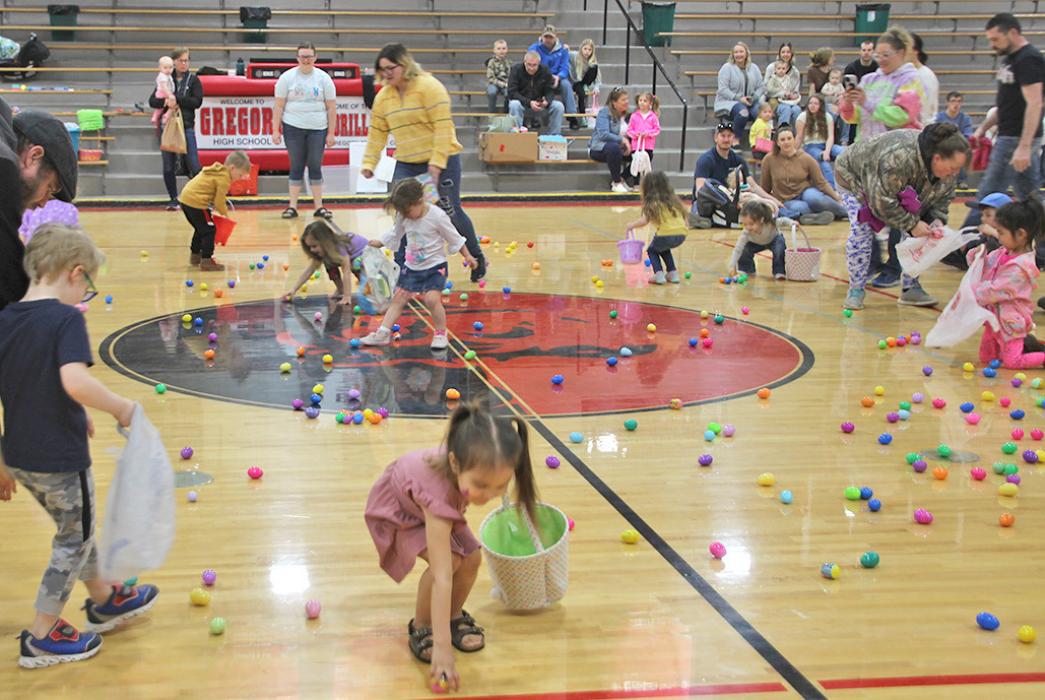 Kids scramble to pick up Easter eggs at the Gregory Memorial Auditorium on Saturday in the annual Easter egg hunt.