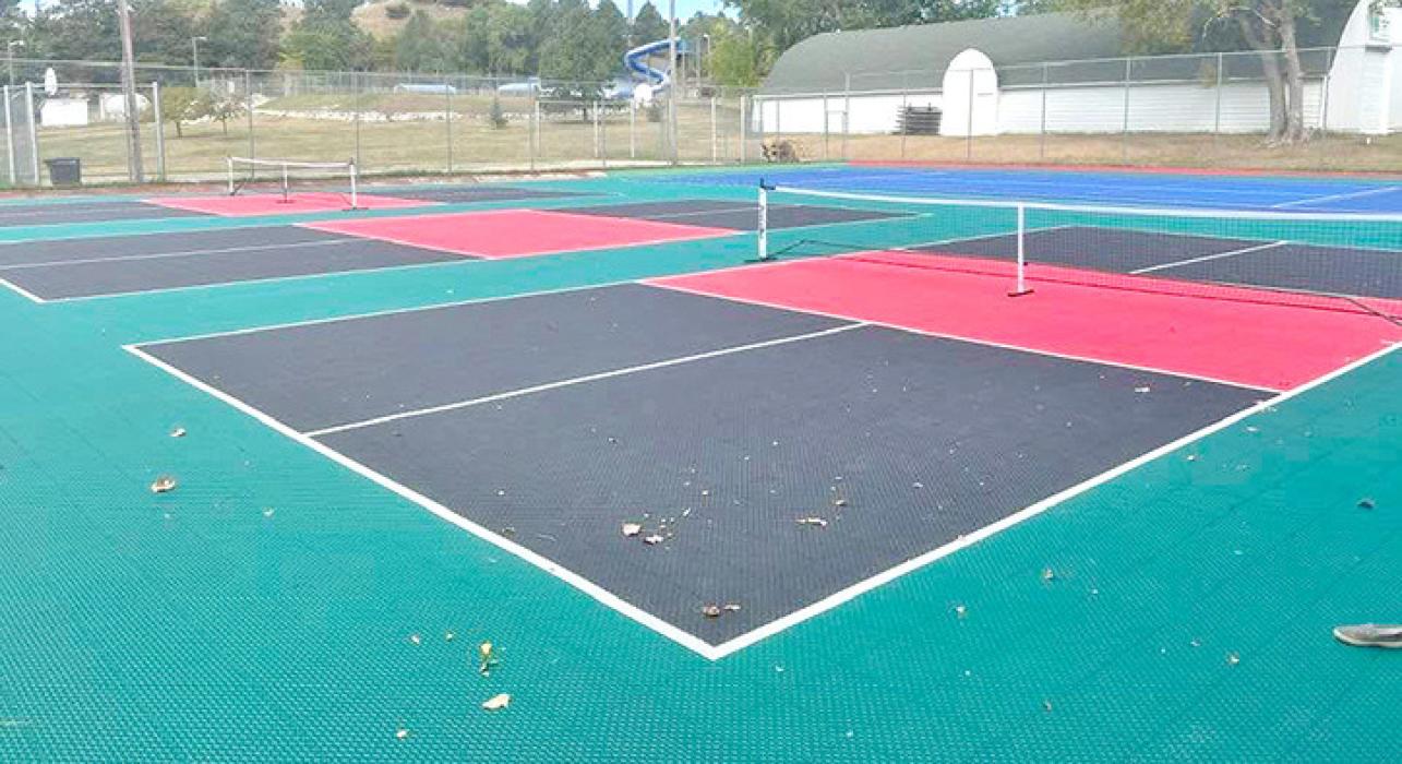 New pickleball courts and a tennis court were installed over the old tennis courts at the city park.
