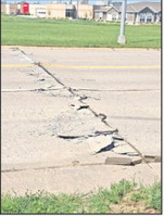 Extreme heat caused Highway 18 to buckle on the east side of town.