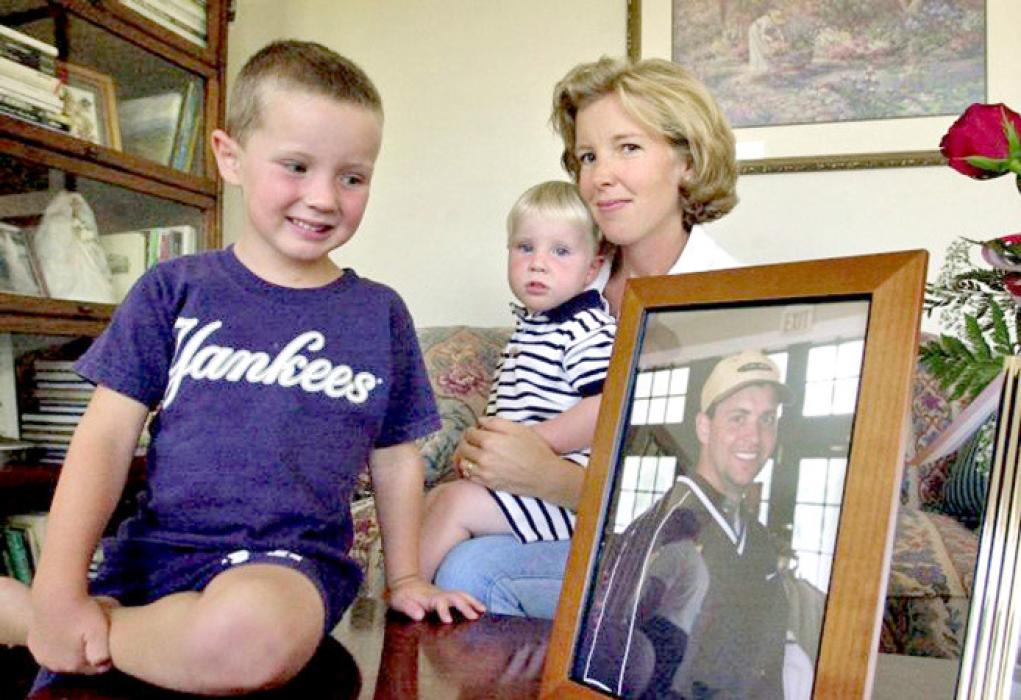 Todd Beamer’s children and wife, Lisa, sit beside his photo in their home in Cranbury, N.J.