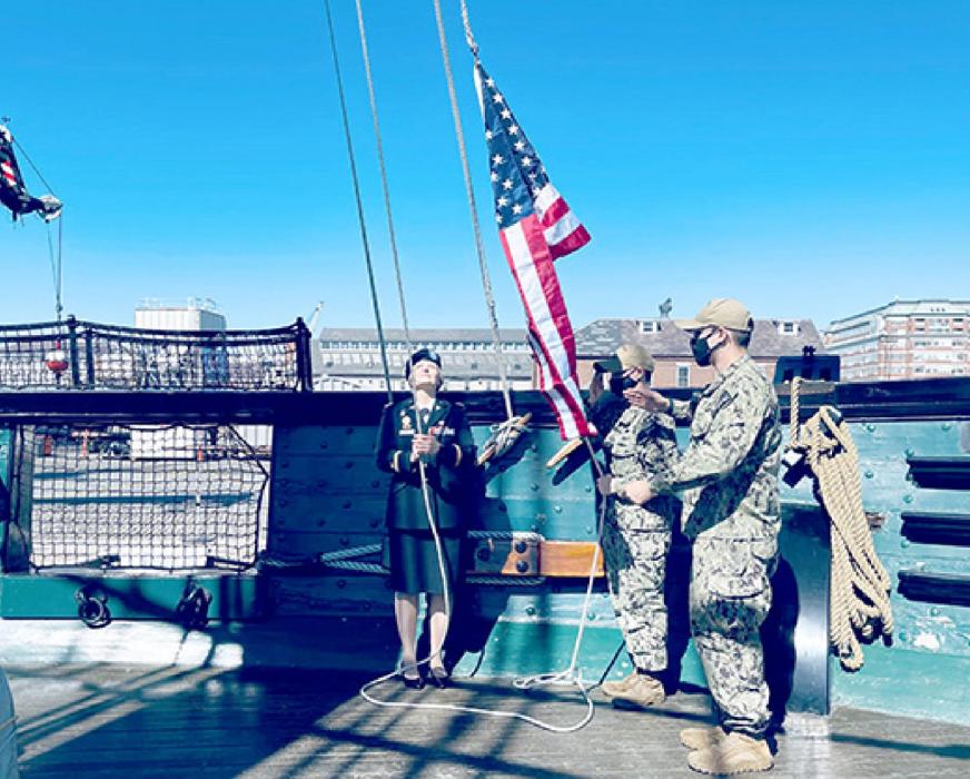After the new shoulder boards were placed, Cushing and her father, a Vietnam veteran, flew the American flag on the USS Constitution.