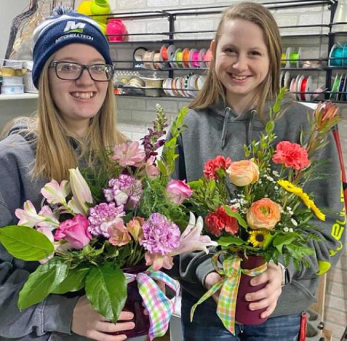 Gracie Dummer and Sidney Hannahs with some arrangements for floriculture.
