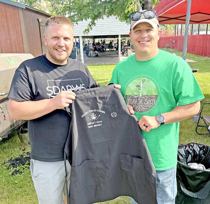 Alex Hamilton, l, and Mark Braun of Smoke ‘em if you got ‘em, proudly display their 2024 Ribfest apron. They placed third in the brisket division.