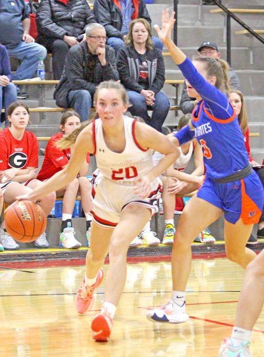 Asia VanDerWerff makes her way around a Parkston defender in last Monday’s game at home.