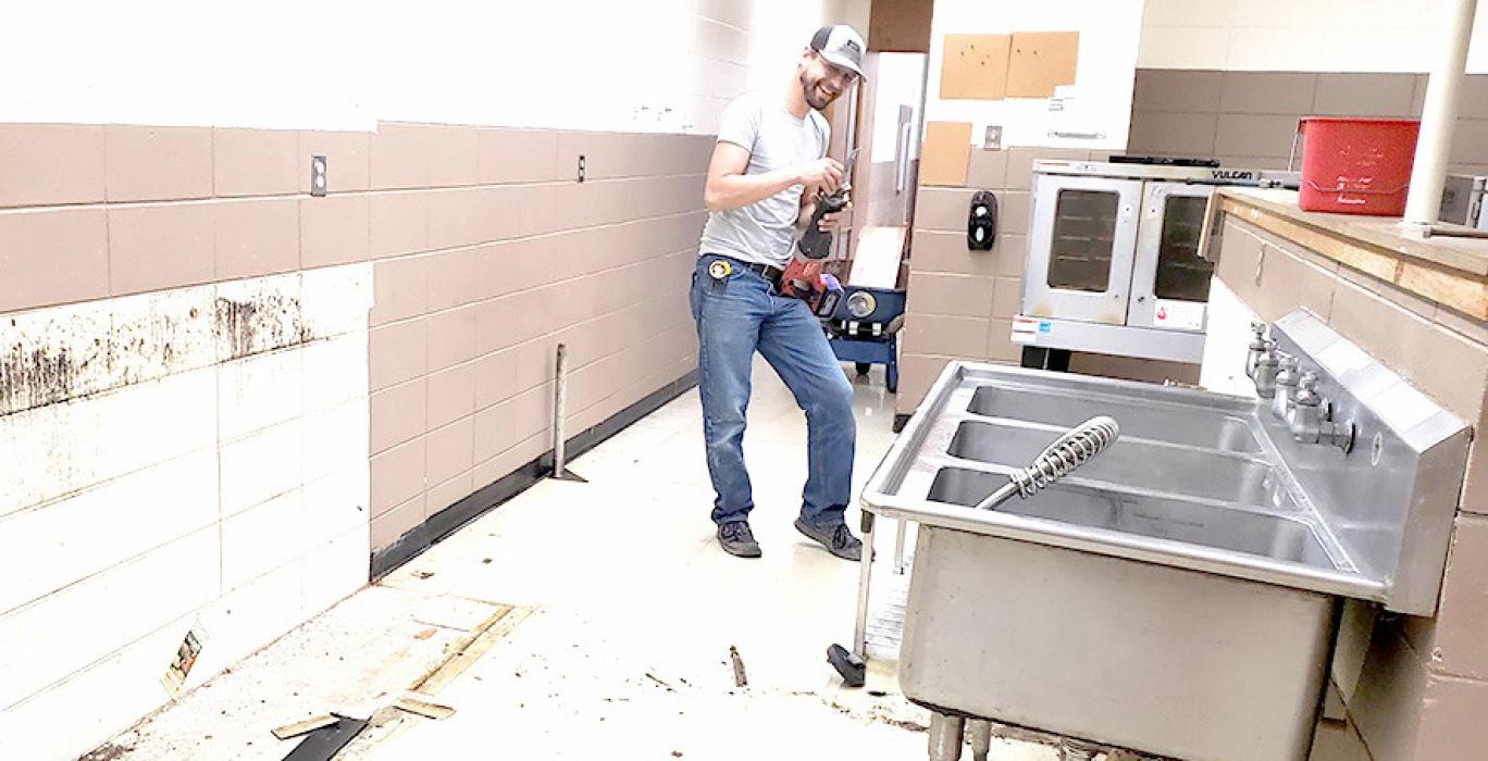 Construction workers wasted no time getting started on the school’s kitchen remodel, starting demolition on the first Monday after the last day of classes.