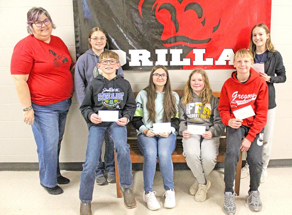 The Gregory American Legion and the Dallas American Legion held an American poetry contest for sixth graders and essay contest for seventh graders. Gregory teacher Mrs. Christina Baldwin is pictured with the winners from l to r: Baya Dehning (2nd place - 7th grade), Robby Ring (2nd place - 6th grade), Emma Brozik (1st place - 7th grade), Harper Wenger (1st place, 6th grade), Emmett Shaffer (3rd place - 6th grade), and Aubree Stevicks (3rd place - 7th grade).