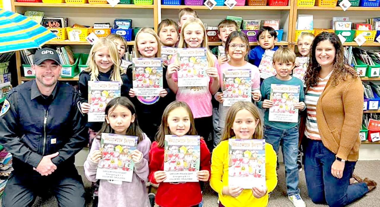 The Gregory Police Department visited the first and second grade classes at Gregory Elementary School prior to Halloween to discuss safety tips for trick-or-treating. All the students were given a coloring book to remind them about what they learned. Police Chief Ryan Cook is shown above with Mrs. Bartling’s second grade class.