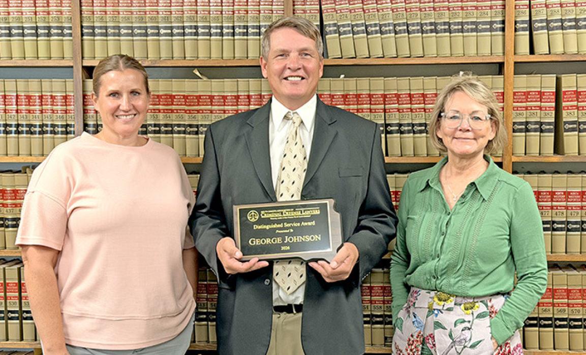 Left to right; Amy Johnson, George F. Johnson with his Distinguished Service award, and Steffanie Pochop.