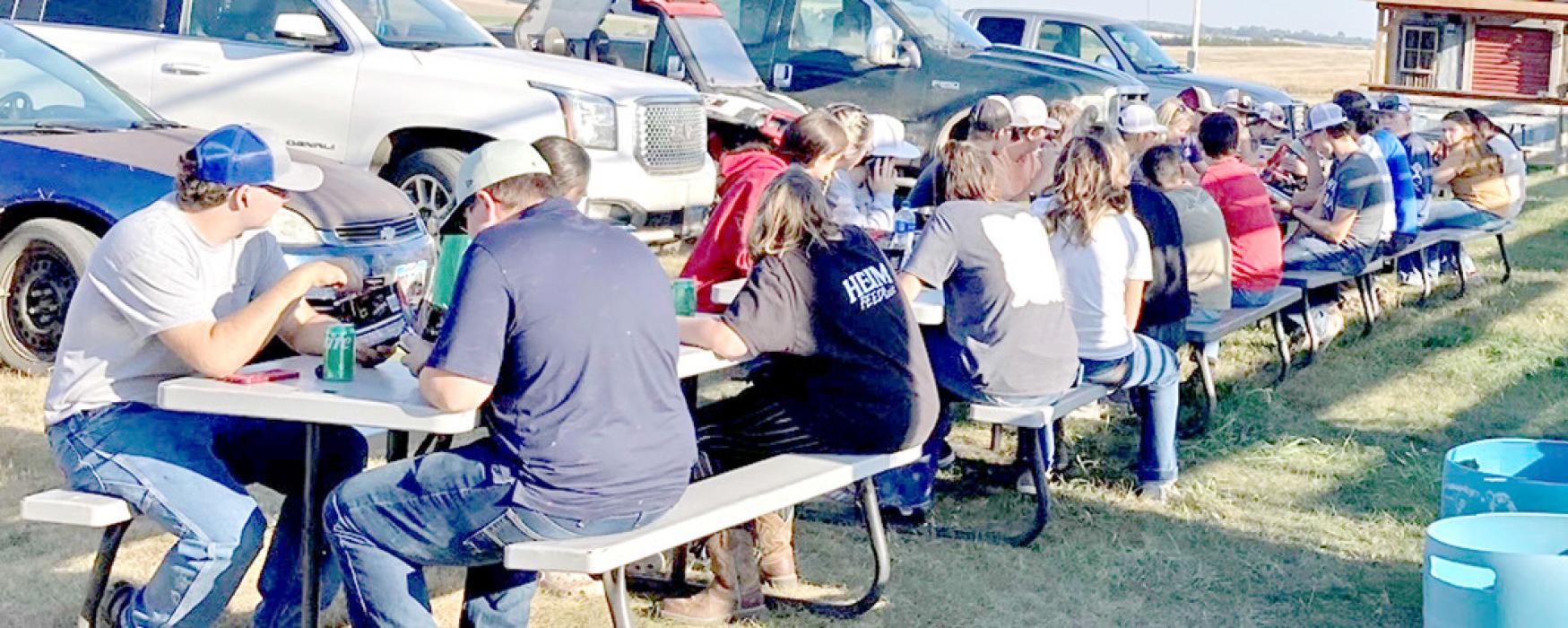 Gregory County FFA members enjoy a meal as part of their Sept. 17 meeting, which also included a community service project and event planning.