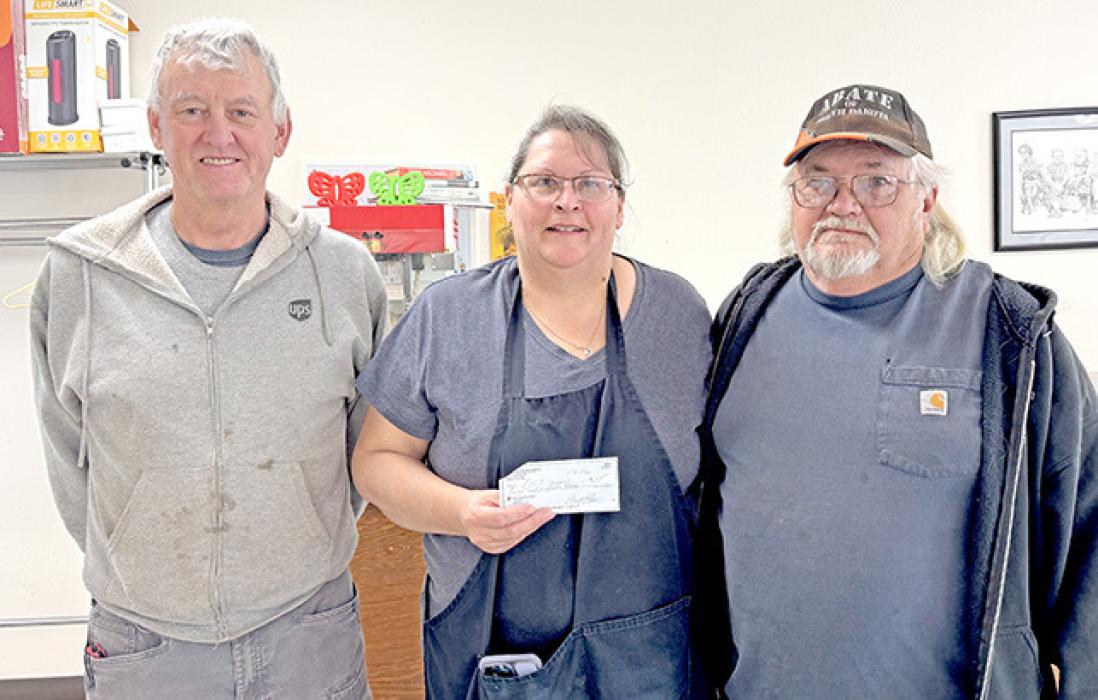 Randy Farley, l, and John Vosika, r, of North Star A.B.A.T.E. also presented a check of $200 to Bernadine Holmberg of ROCS Dining Services.