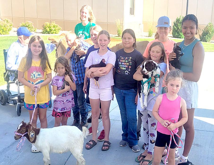 Last week the Border Bumpers 4-H Club members held a petting zoo at the Avera Rosebud Country Care Center in Gregory. They brought kittens, a dog, a Jersey cow, goats, and rabbits for a petting zoo for the residents. Members of 4-H who participated were Nova and Milo Serr, Liz and Lydia Wonnenberg, Lashya Graesser, Cora and Zona Serr, and Cierra Graesser.