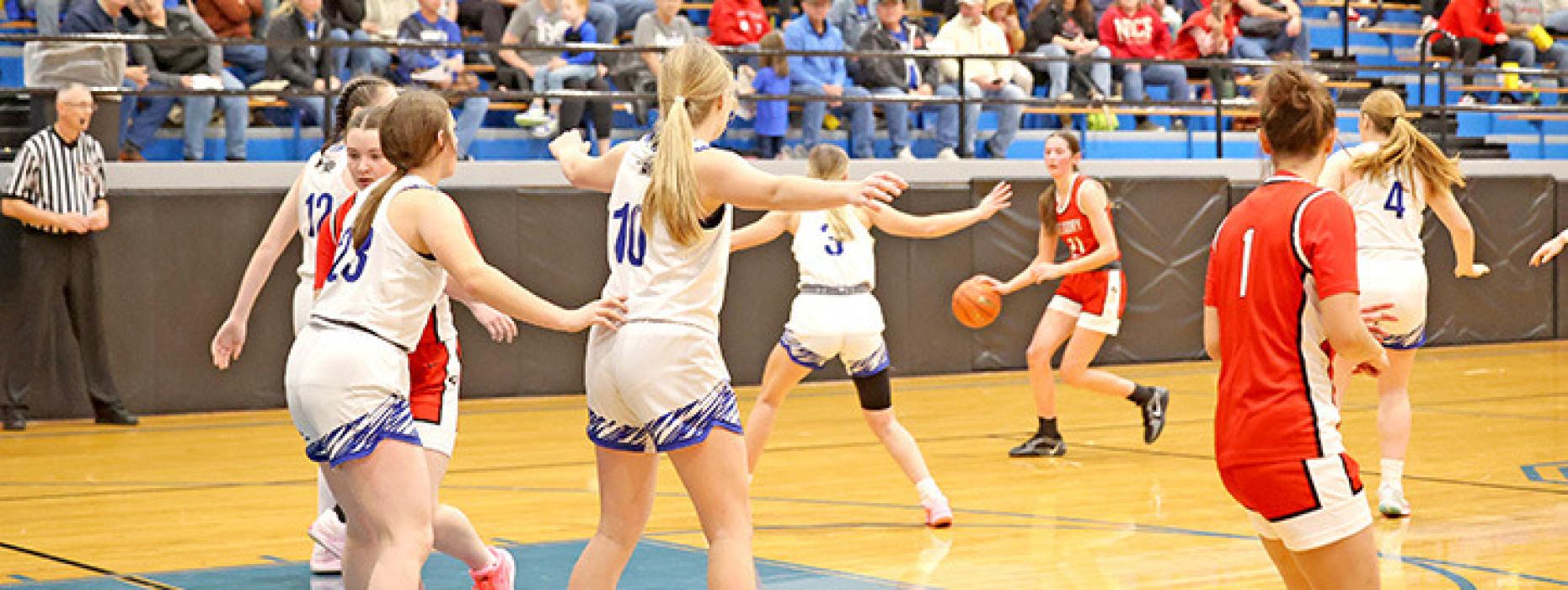 Regan Graesser faces a wall of North Central defenders in Saturday’s game in Springview.