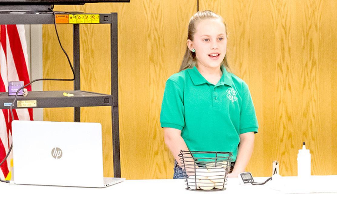 Mya Koenig demonstrating incubating eggs.
