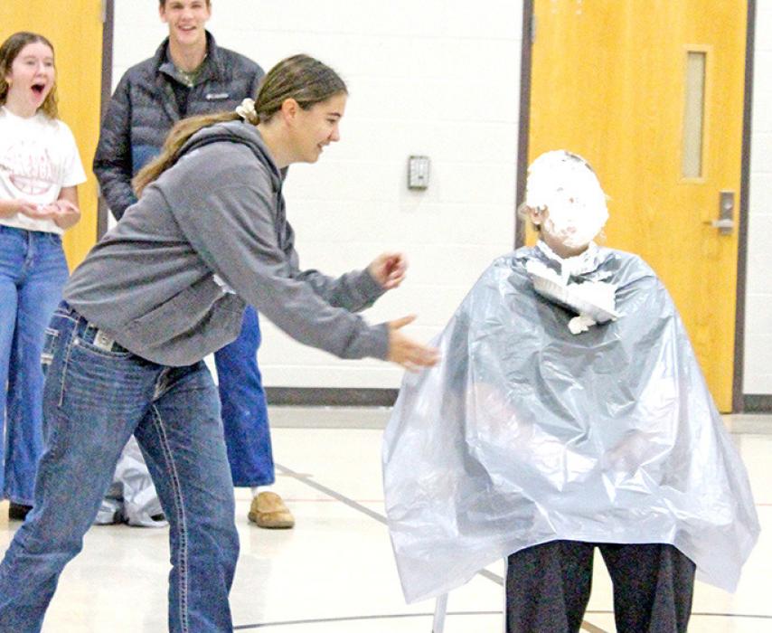 Marissa Fischer was very thorough in applying pie to the face of Mrs. Graber for the third $1,000 raised by the students.