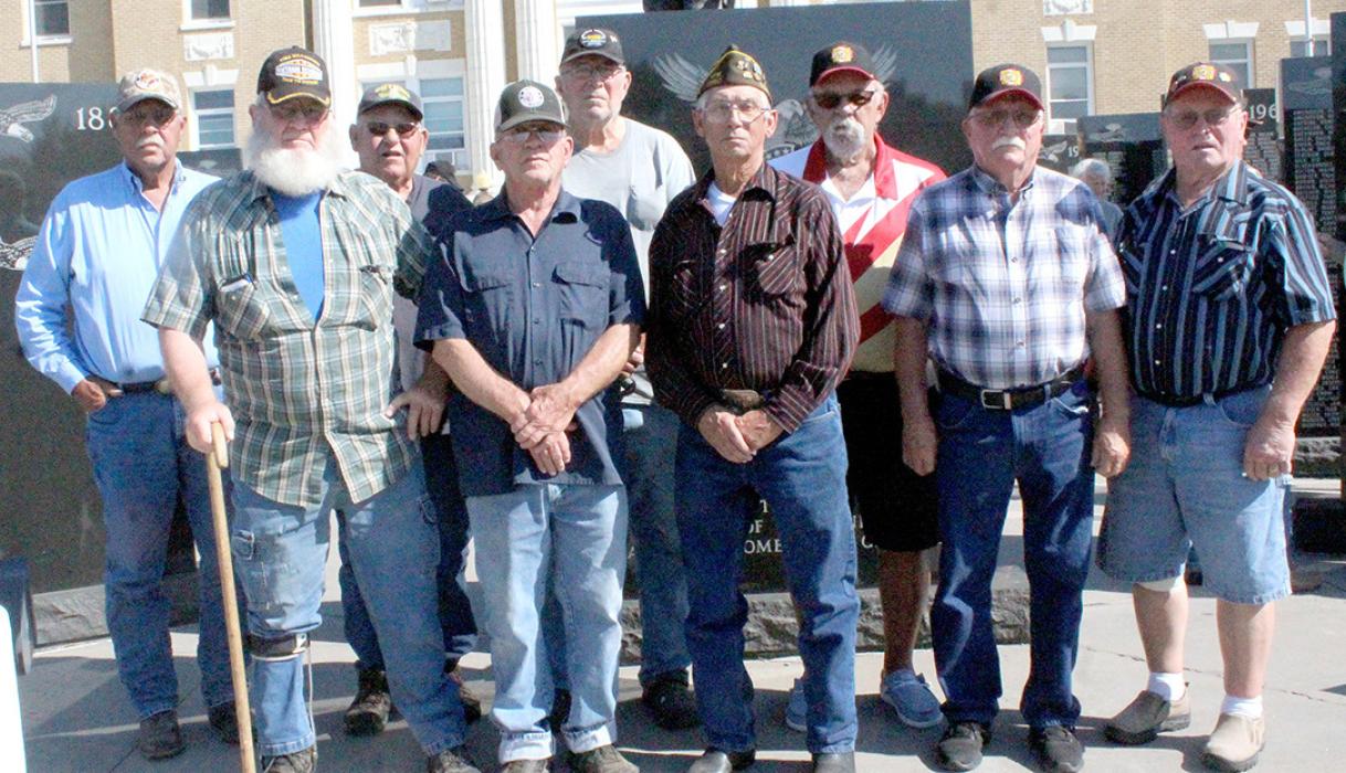 Vietnam veterans from the Gregory/Burke area received medals from Rep. Dusty Johnson at the Winner courthouse on Thursday, August 11, 2022. Those receiving medals were, back row, l to r: Dave Beck, Doug Lindquist, Donald Emme, and Dennis Pense. Front row, l to r: Melvin Peck, Allen Johnson, Don Soesbe, Robert Cihak, and Richard Rubel. (Photo by Dan Bechtold, Winner Advocate)