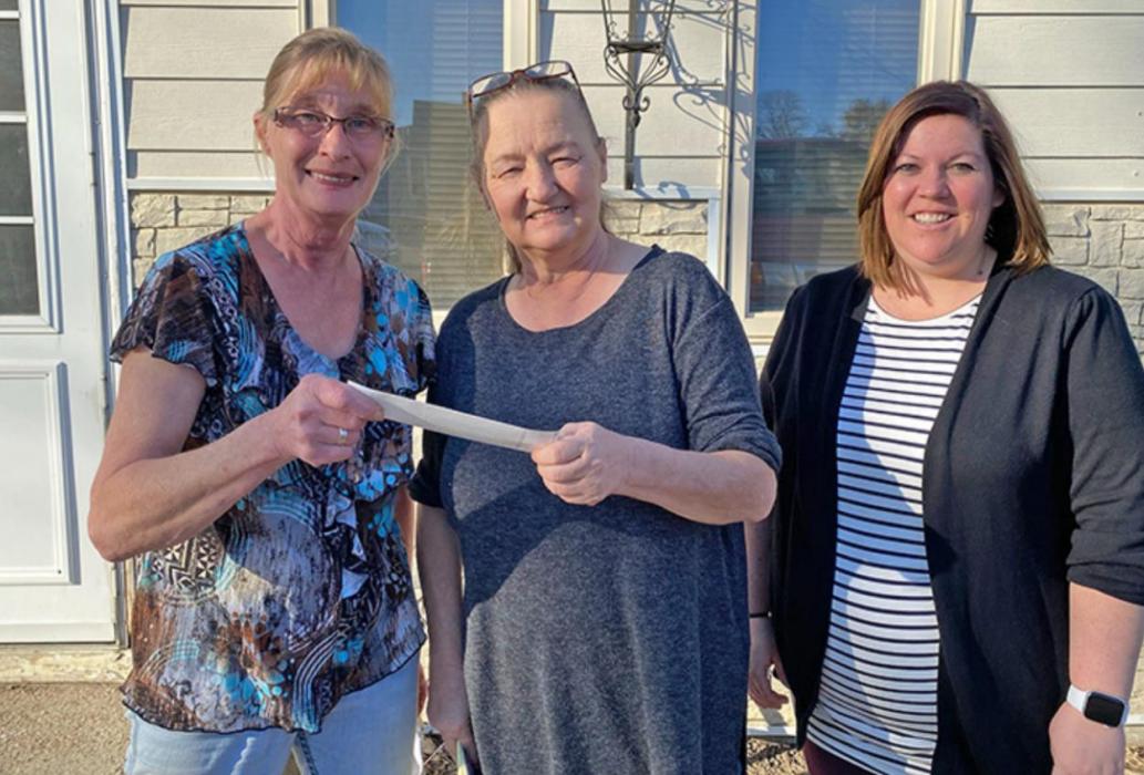 Presenting Marlene Rezac a check for over $5,400.00 is Alisa Schmitz and Lisa Kerner from the IOOF Lodge. The fund-raiser was held to help raise money for medical expenses for Marlene.