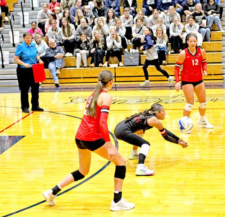 Haylie Vaughn digs the ball for the Spikers.