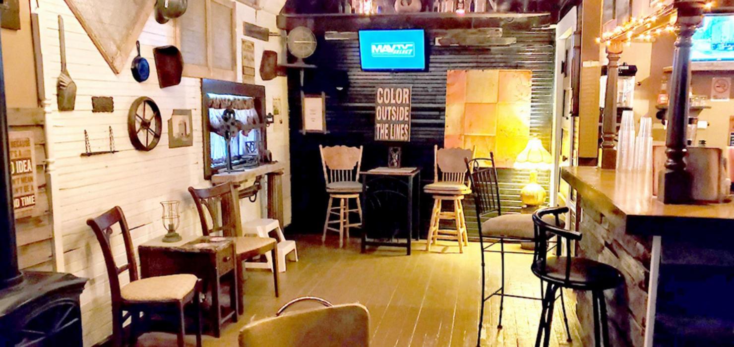 Inside, the bar is decorated with antiques that Dennis uncovered as he cut the waisthigh grass that had grown over the treasures from the past.