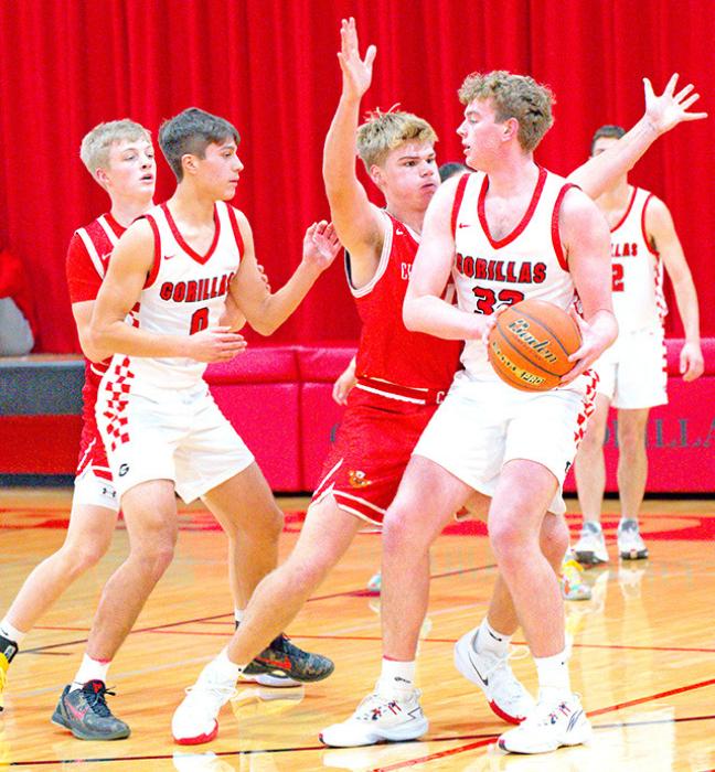 Jackson Bolander and Noah Bearshield pair up in the Gorillas’ big win against Chamberlain on Tuesday, December 17, 2024, at home. (Photo by Calli Jo Photography)