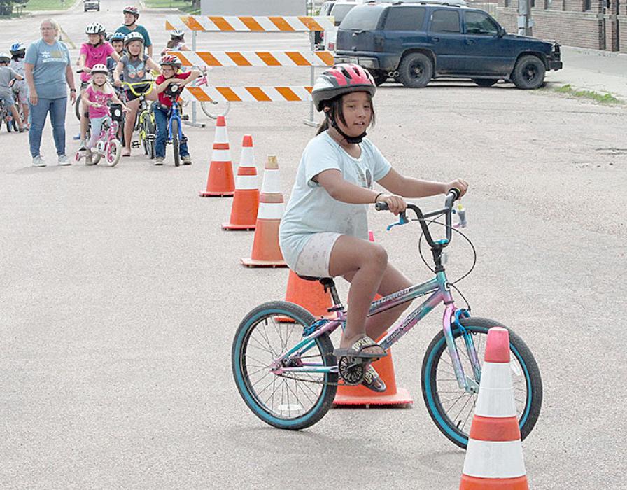 Kristi Drey assisted with the line at the beginning of the bike course, sending riders when it was their turn.