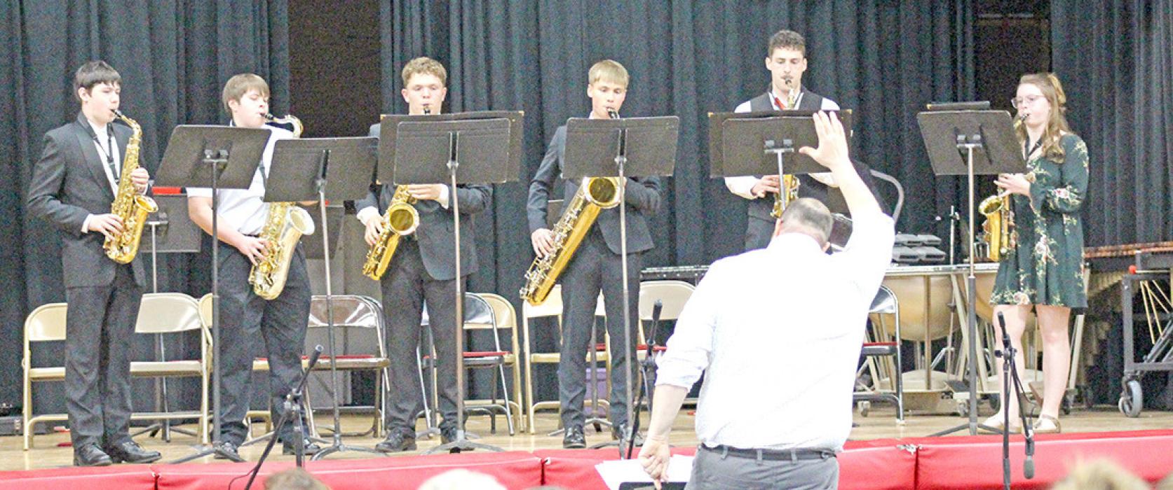 Monday evening was a night of music as the Gregory students performed at the Gregory Memorial Auditorium. The saxophone sextet consisting of l to r: Ben Stevicks, Max Bearshield, Dale Smikle, Lincoln Juracek, Cole Serr, and Charissa Ring, played Pizza Party.