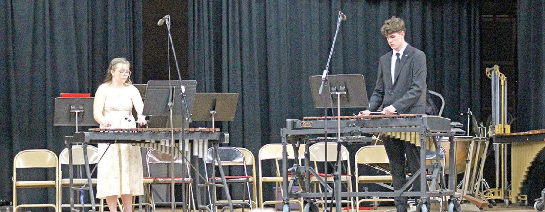 Madi Graber, left, and George Timanus, right, played Hey Johnny Polka on the xylophones.