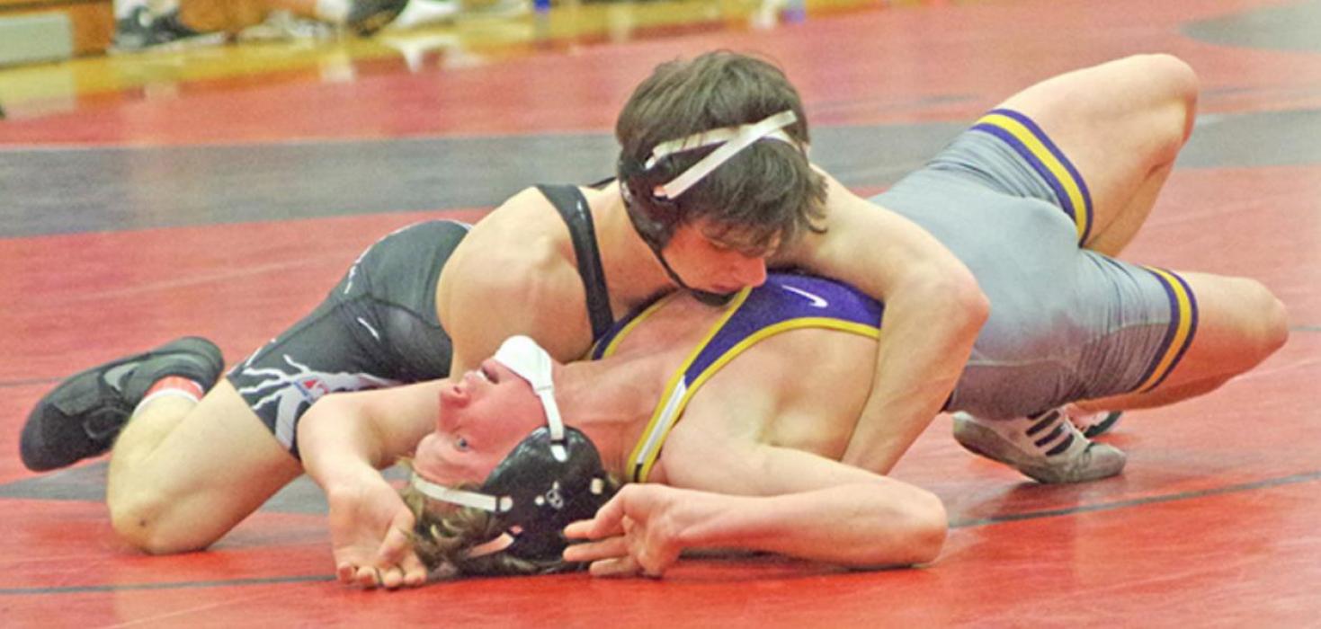 Owen Hansen scored a pin, a technical fall, and a major decision to earn a championship at the region 3B tournament and a #1 seed at the state tournament. (Photo courtesy of Burke Gazette)