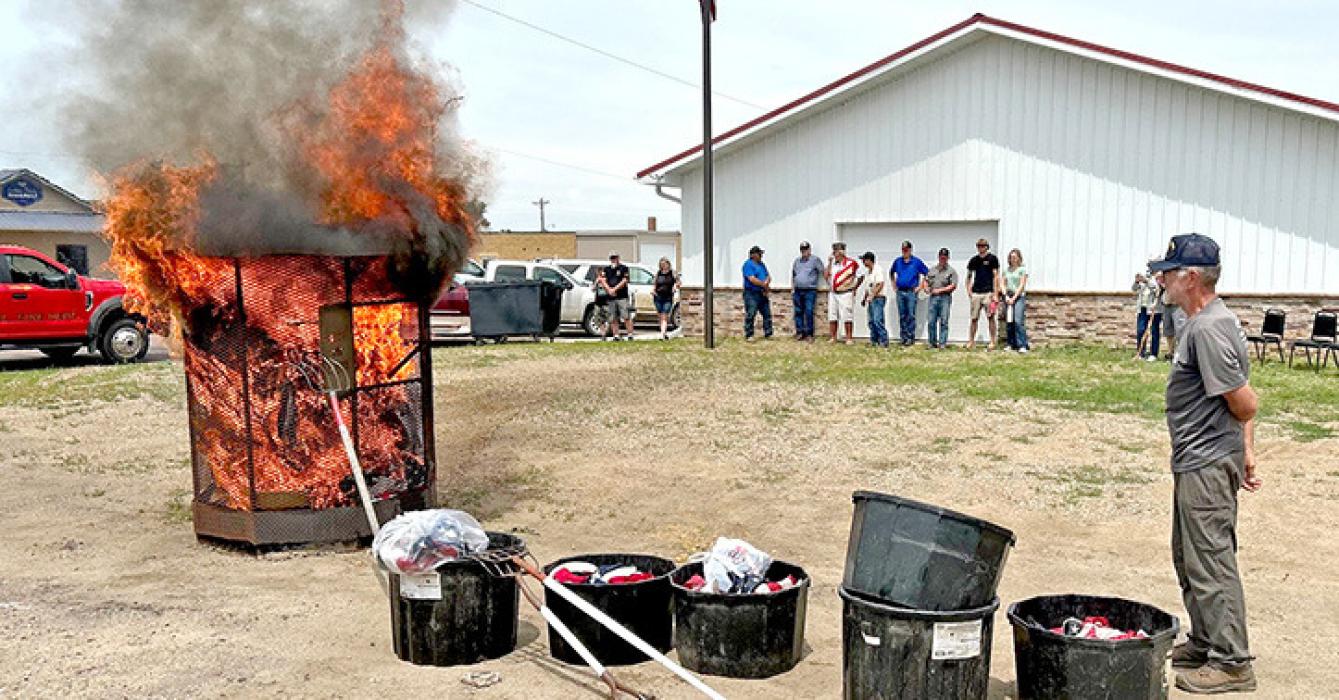 The Burke American Legion and Burke VFW held their annual US Proper Flag Disposal Ceremony on Flag Day, June 14, 2025. Roland Holub, Burke Legion Commander, presided over the ceremony. Nearly 20 people gathered outside the Burke VFW Post #9950 on Saturday. There were about 450 unserviceable flags to be disposed of that had been turned in or dropped in the drop box outside the VFW.