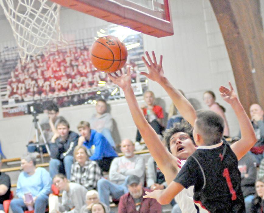Nick Kenzy shoots the ball as a St. Mary’s defender challenges him. The Gorillas played well, but St. Mary’s 10 of 13 3-pointers in the first half was too hard to beat.