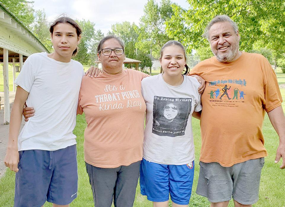 Frances (second from left) and Robin (far right) Bair and their children were one of the families that participated in the Spiritual Run for the Sacred Pipe.
