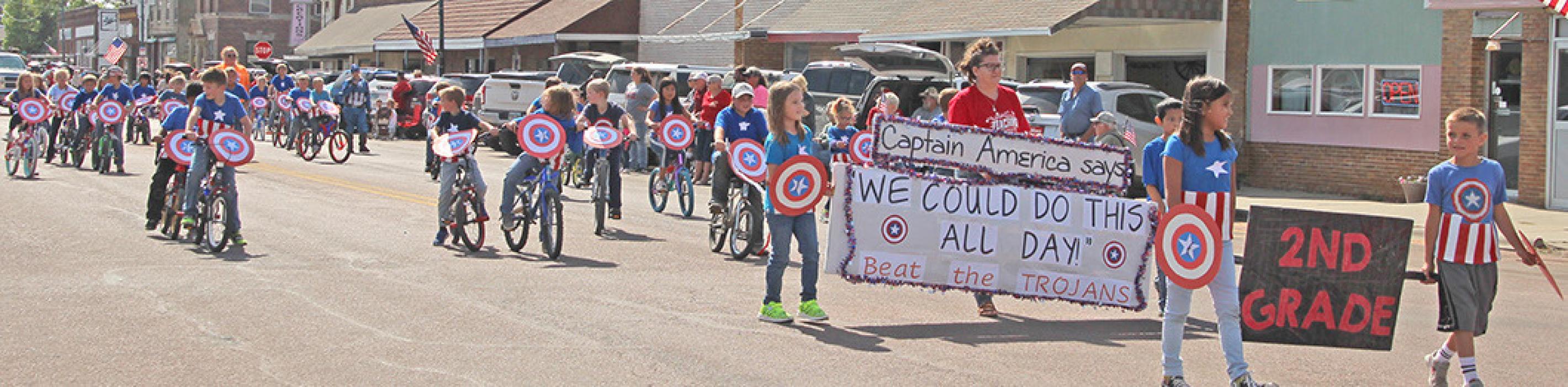 A second grade class full of Captain Americas on bikes claiming, “We could do this all day,” earned second place.