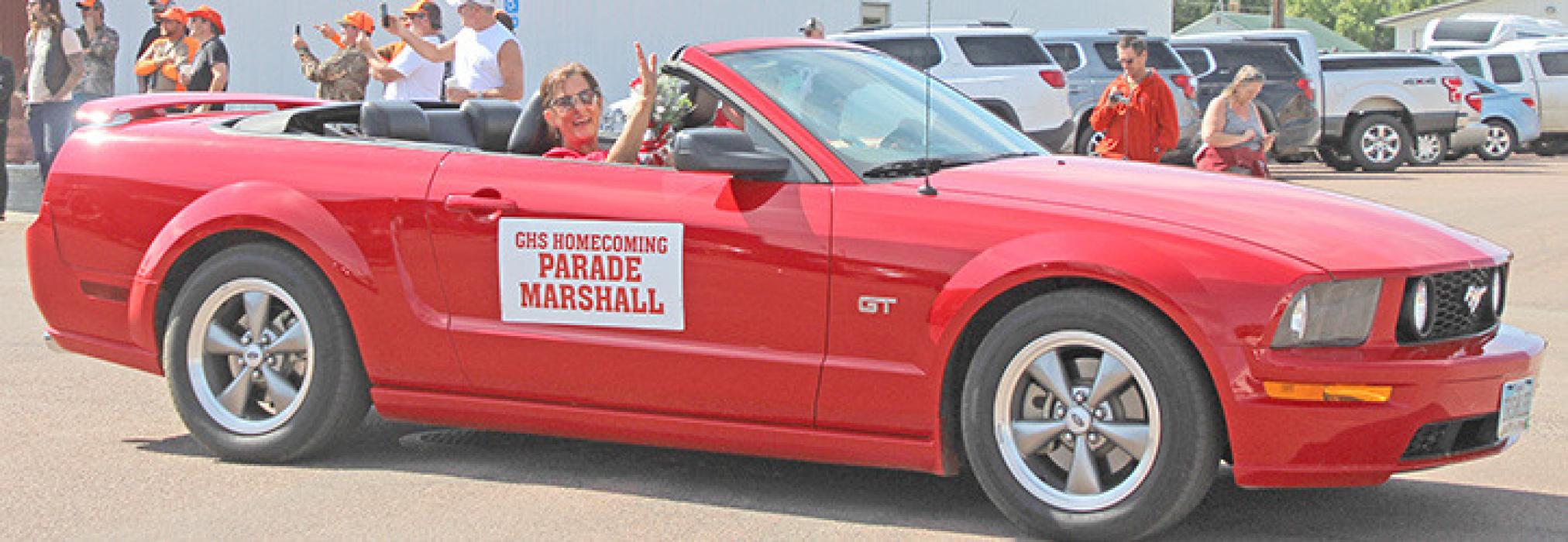 Parade Marshal Roxie Chocholousek led the parade in a red convertible.