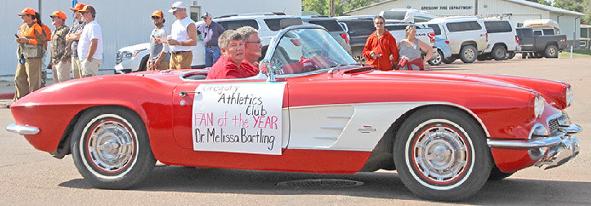 Fan of the Year Dr. Melissa Bartling was driven by her dad in her grandfather’s convertible.
