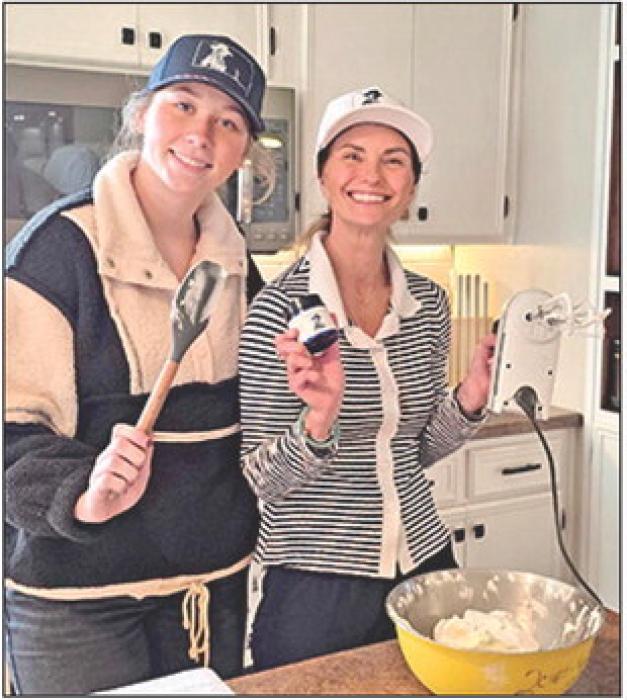 Cassidy Keiser, l, assists Katie with the growing business when she is home from college.