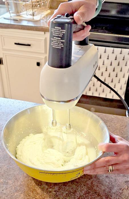 Katie uses a hand mixer so that she can better feel the consistency as the tallow is whipped.