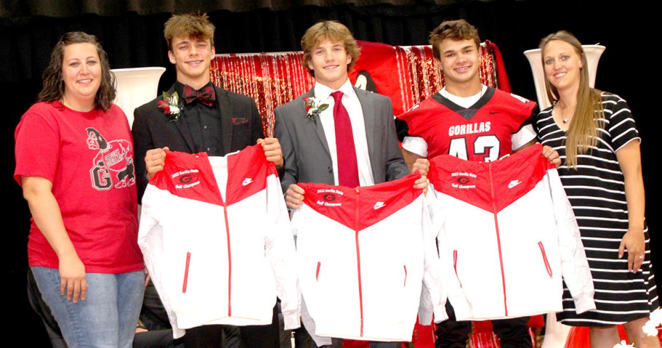 The 2022 State Champion golf team received jackets during the coronation ceremony. Shown l to r, they are Coach Kaitlyn Steffen, Eli Fogel, Kade Stukel, Trey Murray, and Coach Britany Reber. Not present: Coy Determan.