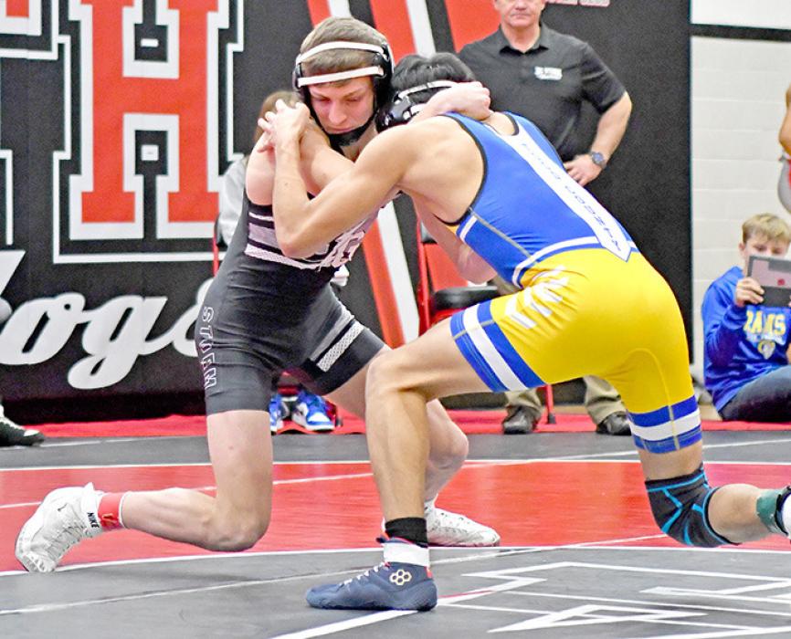 Eli Ekroth pinned all three of his opponents to get his first high school tournament win on Saturday in Ainsworth. (Photo by Ainsworth Star Journal)