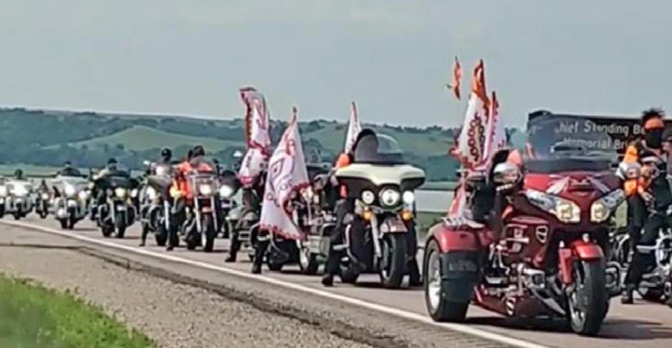 A caravan of at least 100 cars and 50 motorcycles head west after crossing the Missouri River to honor the Rosebud Sioux children who died at a boarding school in Pennsylvania over 140 years ago. (Photo courtesy of Gibby Dillon)