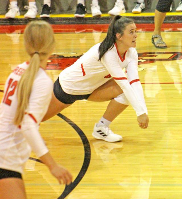 Anna Dargatz goes low for a bump. (Photo by Katherine Stevicks)