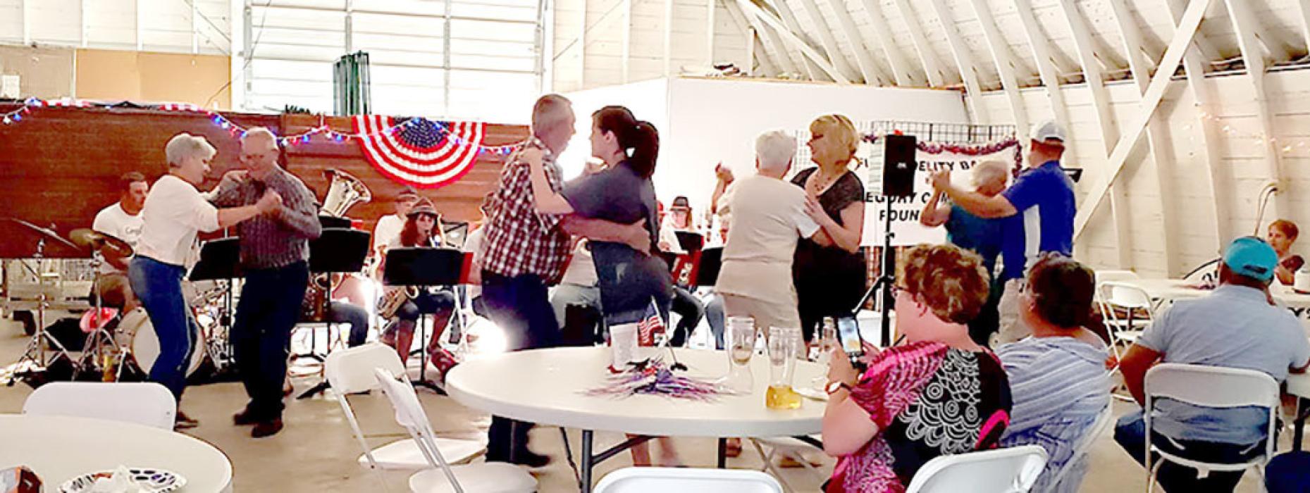 The dance floor was full as couples danced to the music. by the Gregory Polka Band.