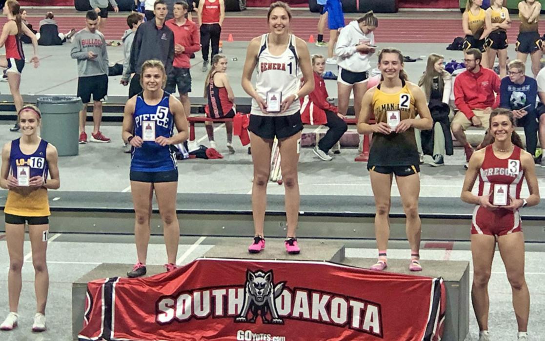 Emma Thomas, right, came home with 4th and 5th place plaques in the 1600 and 800 meter runs respectively.